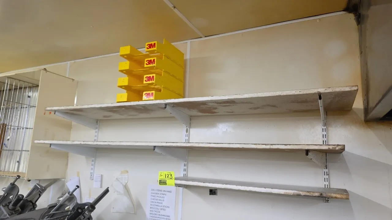 Laminate wood shelves with metal brackets. Features white finish and adjustable metal shelf brackets. Includes 3'L and 6'L shelves with wall standards