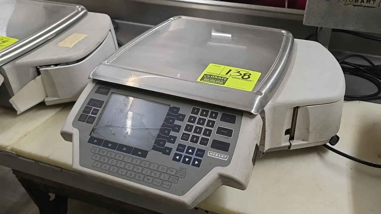 Hobart Quantum-P food scale with integrated label printer. Features stainless steel platter and alphanumeric keypad. S/N: BU-1013-042. Electrical: 120