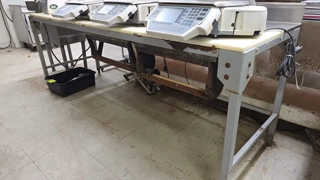 Metal frame poly top work table with backsplash. Features under-table roll holders and painted metal frame. 96"L x 30"W. Note: Frame exhibits signific