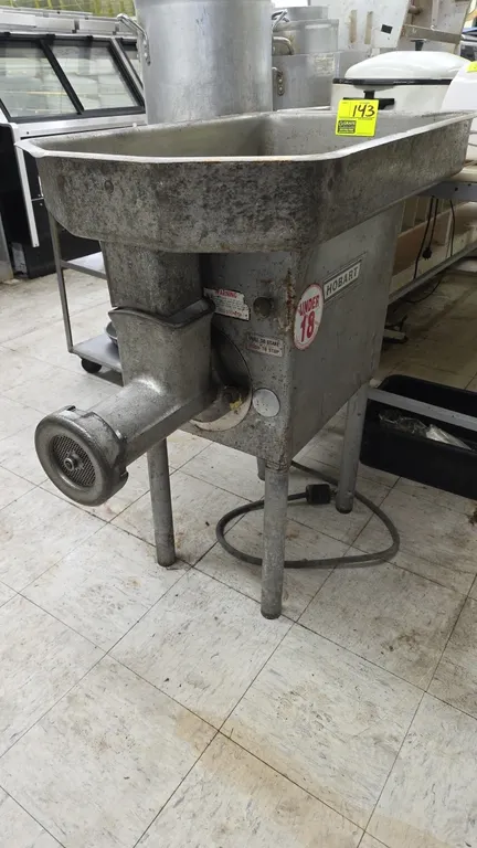Hobart electric meat grinder. Features feed pan with throat safety guard and grinder head with plate. Includes spanner wrench. Electrical: 250V, 3-Pha