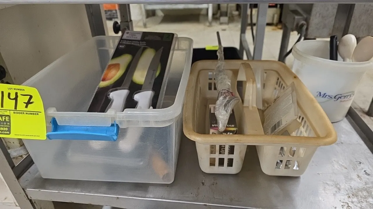 Assorted kitchen cutlery and utensils lot. Includes clear poly latching tub containing Member's Mark 2-pack 6" utility and boning knives, assorted bon