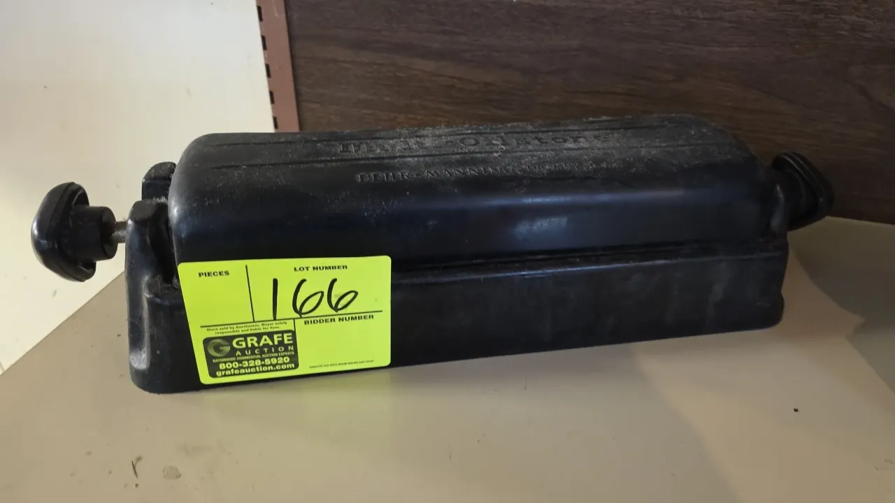 Norton Behr-Manning IM-313 Multi-Oilstone knife sharpener. Features a 3-sided rotating sharpening stone assembly, oil reservoir base, and removable pr