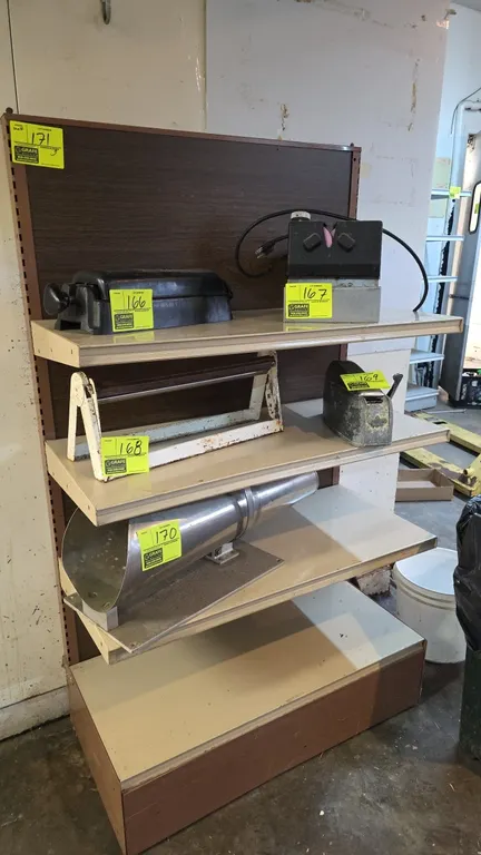 Metal shelving unit. Features (3) adjustable upper shelves, base shelf deck, and woodgrain back panel. 36" x 61". Contents not included.