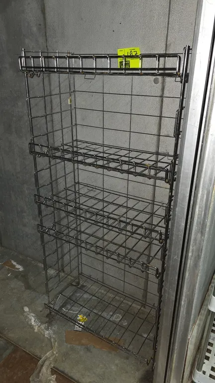 Metal 5-tier wire rack. Features chrome-plated metal wire construction with five wire shelves. Dimensions: 24" x 13" x 52".