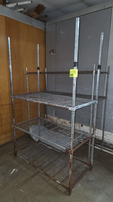 Metal wire shelving racks. Includes (1) 3-tier rack and (1) 2-tier rack with wire grid shelves. Dimensions: 4' to 5'L x 2'W x 5'3" to 6'5"H. Note: Uni