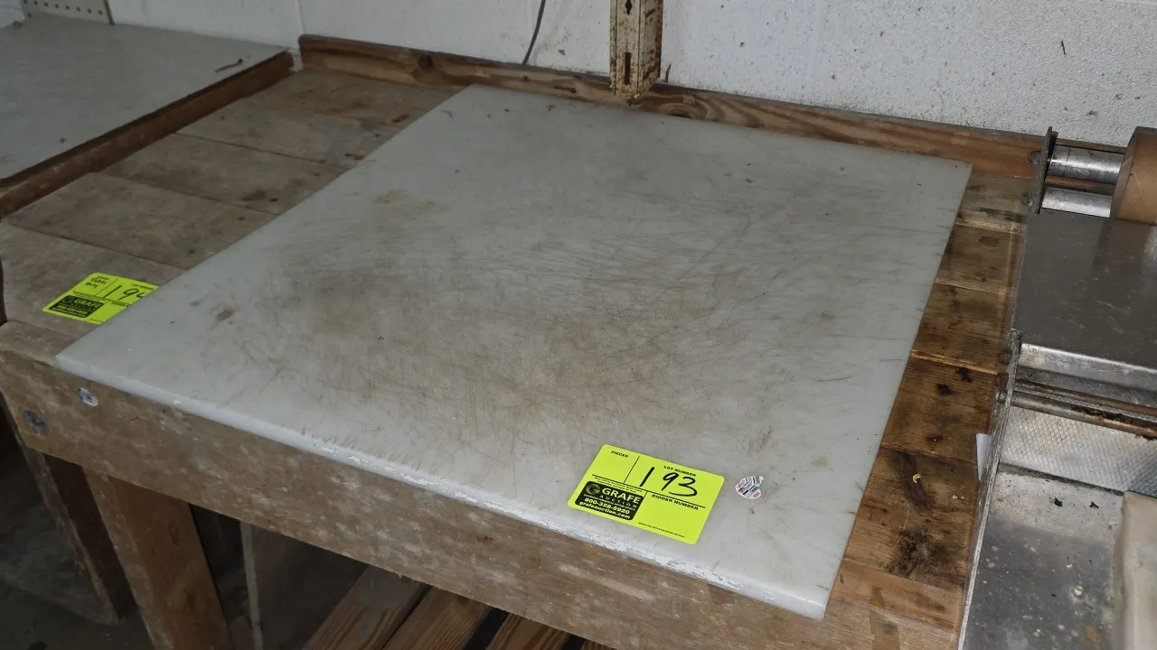 Polyethylene cutting board. White poly construction. 28" x 30" x 1". Table not included.