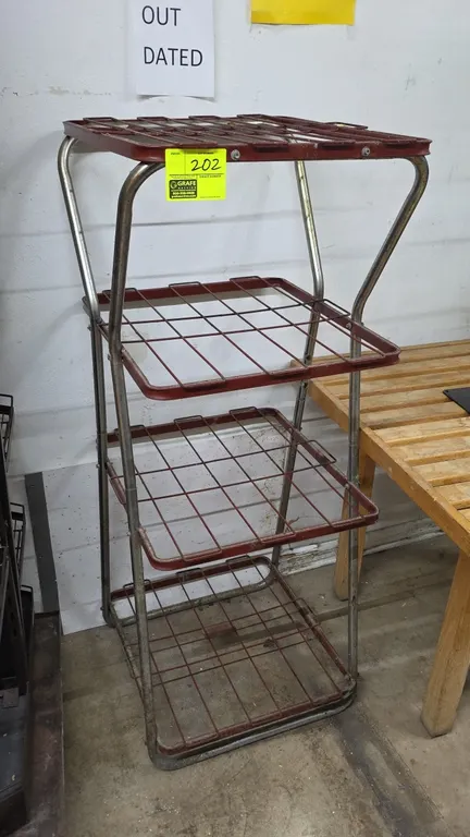 Metal 4-tier rack. Features a tubular metal frame with four wire shelf tiers. Dimensions: 2' x 2' x 5'.
