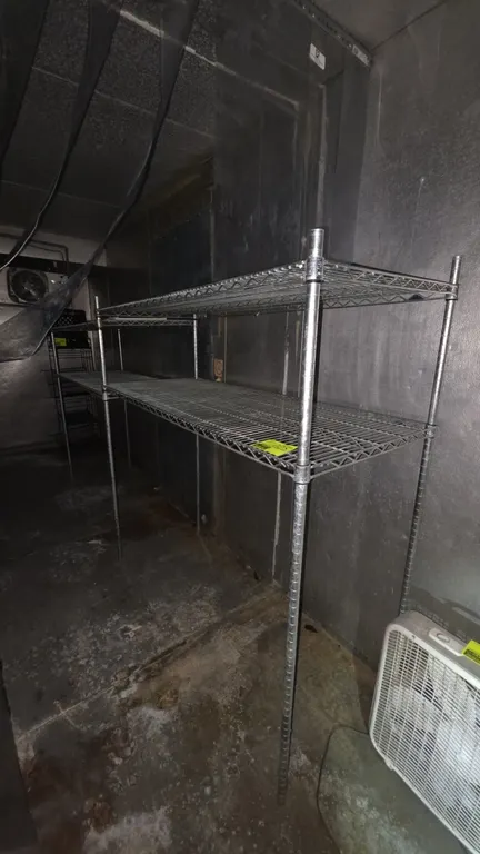 Metro 2-tier wire shelving units. Features wire construction and adjustable shelf heights. 5'L x 2'W x 5'H each. Background items not included.