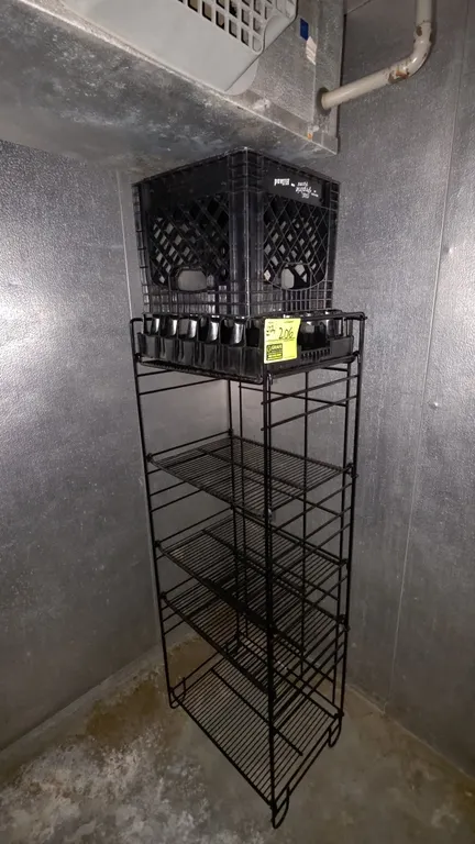 Metal 5-tier merchandising rack. Features adjustable wire shelves and black wire construction. Includes plastic crate and molded plastic organizer tra