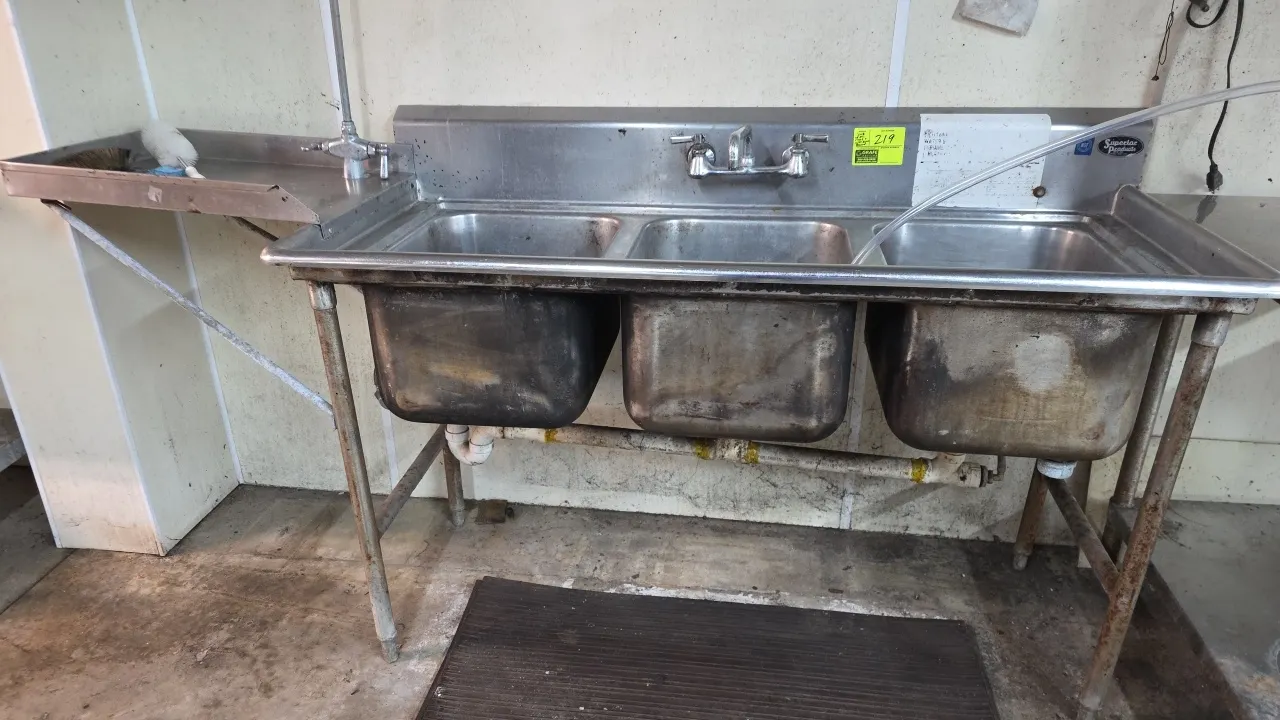 Superior Products stainless steel 3-compartment sink. Features left-side drain table extension, splash-mounted faucet with swing spout, overhead pre-r