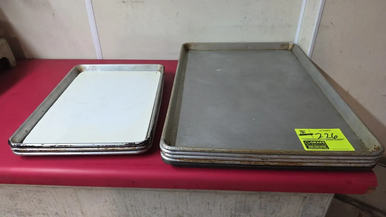 Assorted aluminum sheet pans. Features aluminum construction with reinforced rolled rims. Includes (5) full-size sheet pans and (3) half-size sheet pa