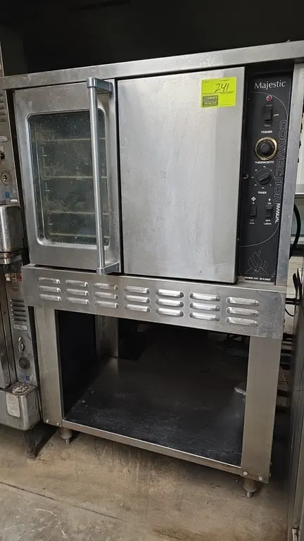 American Range Majestic gas convection oven. Features stainless steel exterior, door with viewing window, manual controls with 60-minute timer, thermo