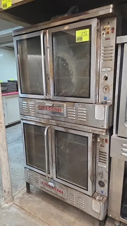 Blodgett commercial double-stacked gas convection oven. Features stainless steel exterior, double glass doors on each cavity, and interior wire racks.