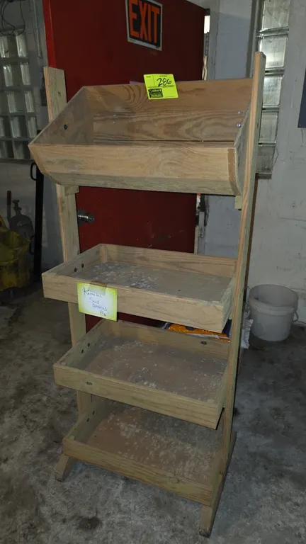 Wood produce merchandiser. Features 4-tier display including an angled upper bin and 3 stepped tray shelves. 5'H.