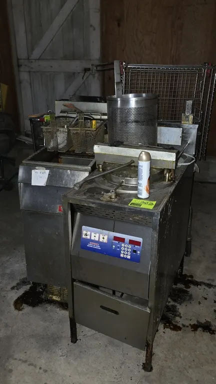Commercial fryer lot includes (1) 16"W Vulcan stainless steel deep fryer with (2) wire fry baskets, and (1) 18"W stainless steel pressure fryer with d