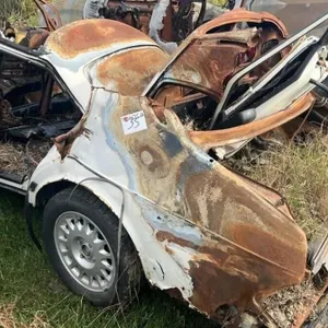 Salvage Vehicle - Burnt Out SAAB. #LOC: OK Tire