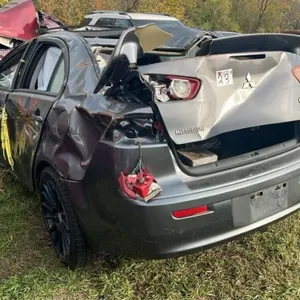 Salvage Vehicle - Mitsubishi Lancer 4DR Car.