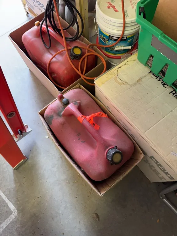 Coleman Camping Fuel Cans, Propane Cylinders, and Red Plastic Fuel Container Lot