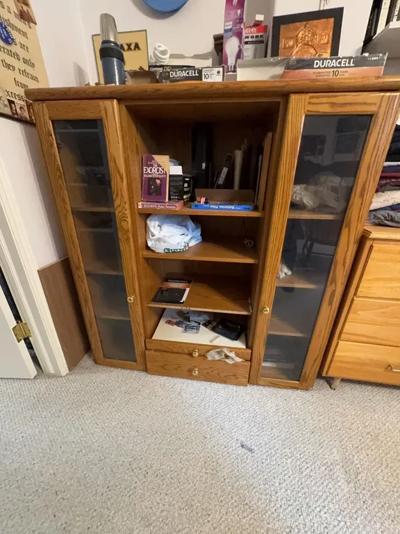 Oak Cabinet with Glass Doors and Contents Including Light Bulbs and Batteries