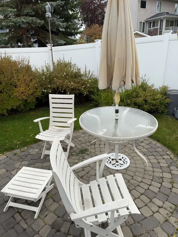 White Outdoor Patio Set With Glass Table, 2 Chairs, Footrest, And Umbrella