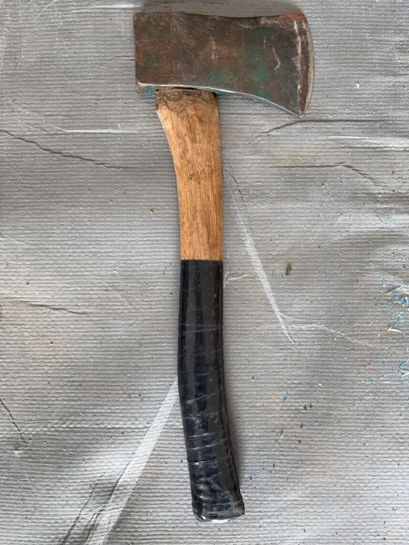 Single-Bit Axe With Wooden Handle and Black Grip Tape
