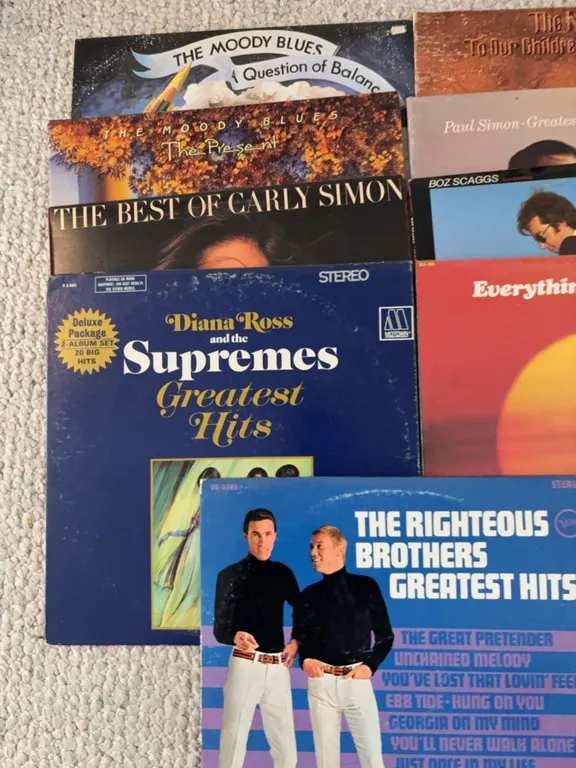 8 Vinyl Records Including The Moody Blues, Carly Simon, Supremes, Righteous Brothers