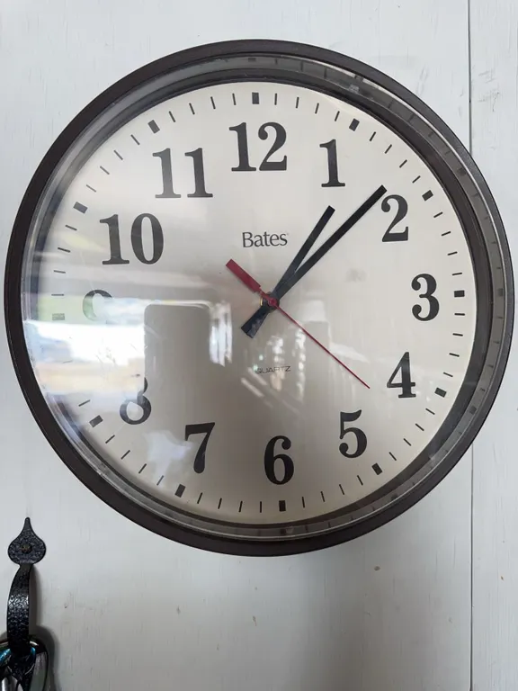 Bates Quartz Wall Clock With Black Frame and White Face
