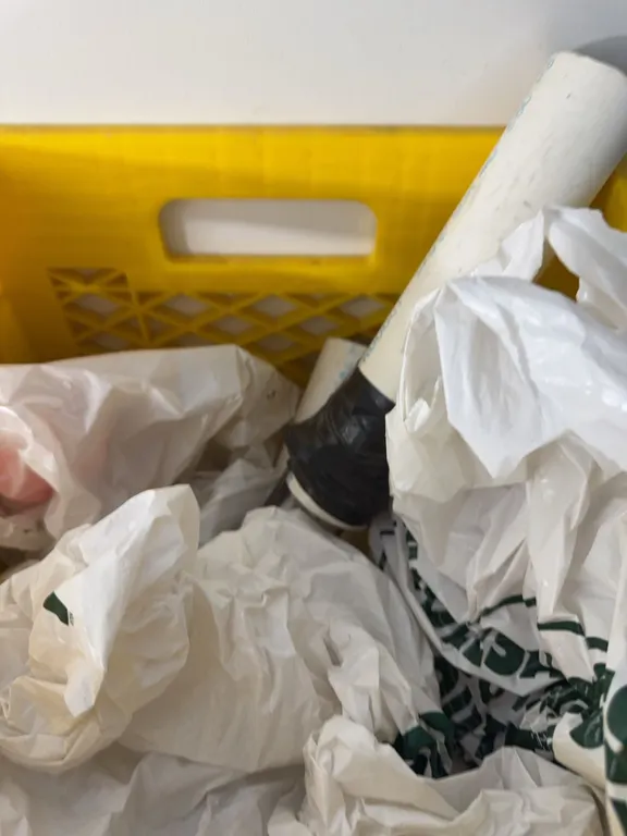 PVC Pipe Sections With Black Tape and Assorted Plastic Bags