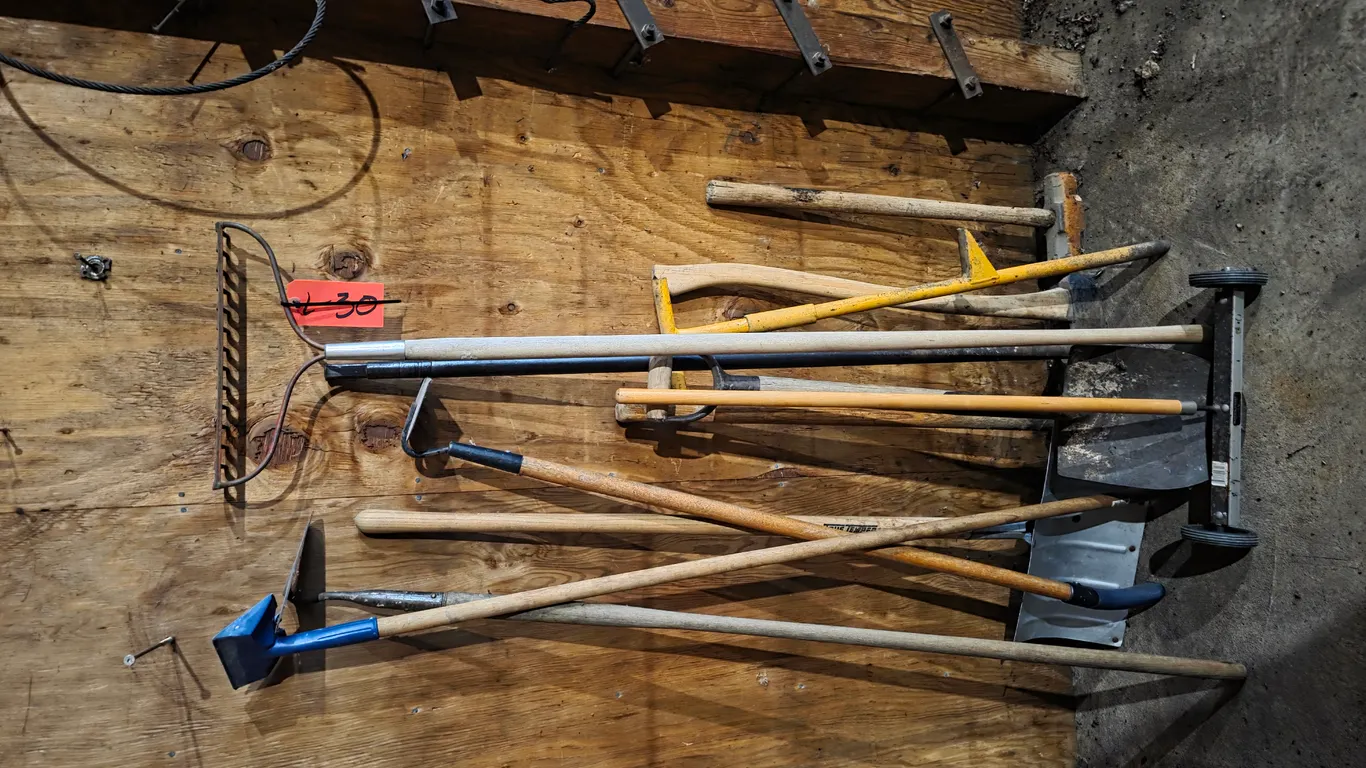 Assortment Of Hand Tools, Rakes, Spades, And Hoes