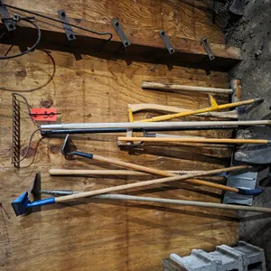 Assortment Of Hand Tools, Rakes, Spades, And Hoes