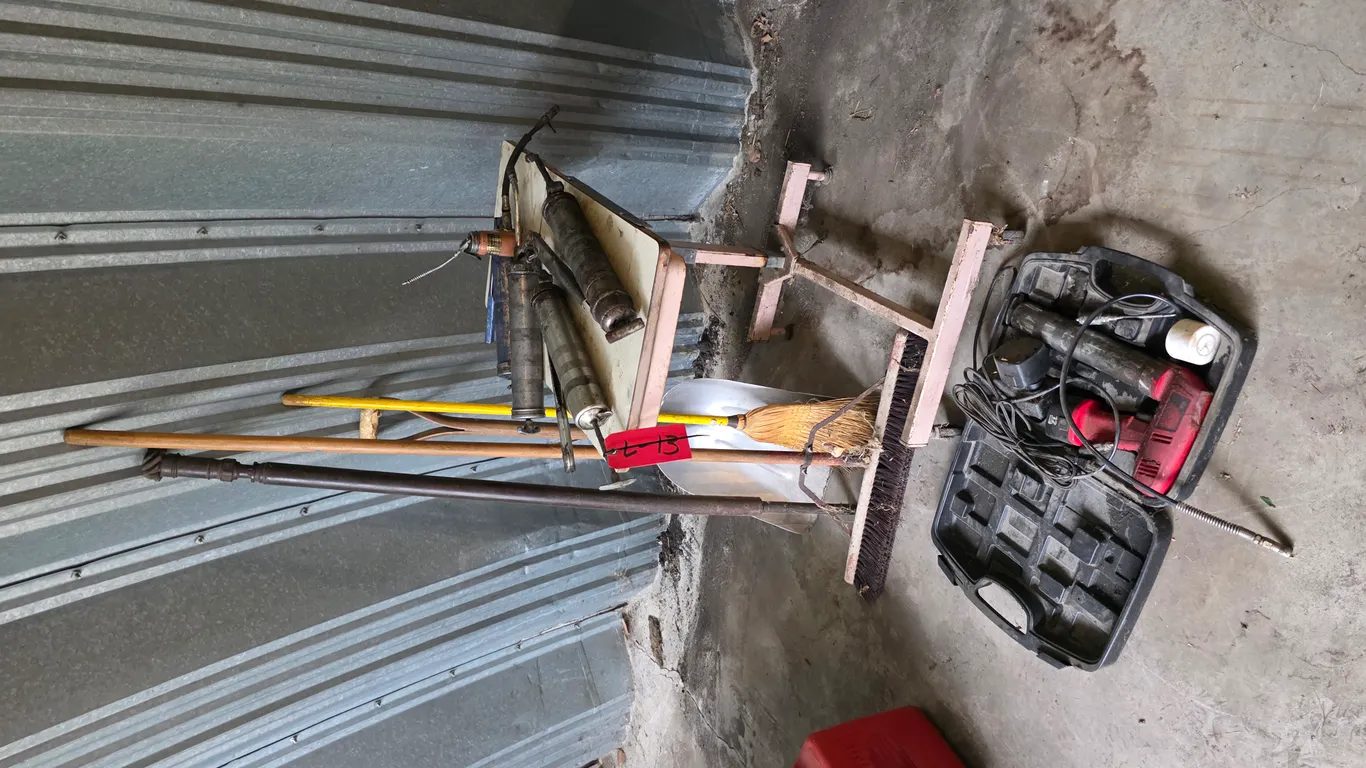 Assortment Of Shovels, Grease Guns, And Brooms