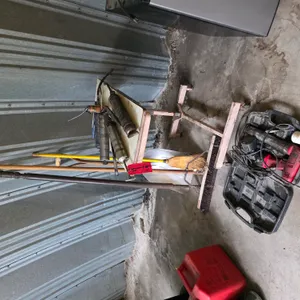 Assortment Of Shovels, Grease Guns, And Brooms