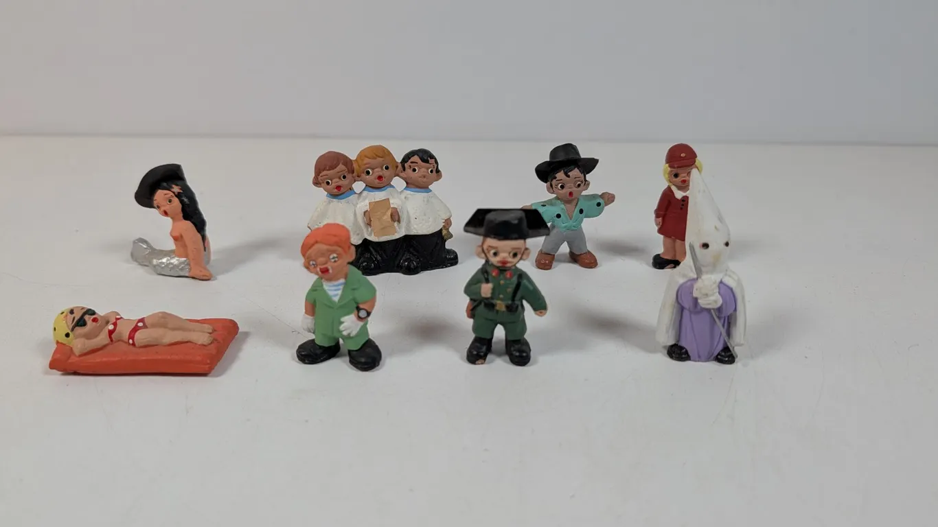 Collection of Hand-Painted Mud People Ceramic Figurines