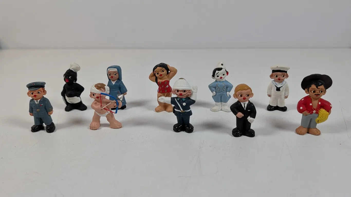 Collection of Ten Miniature Mud People Statues