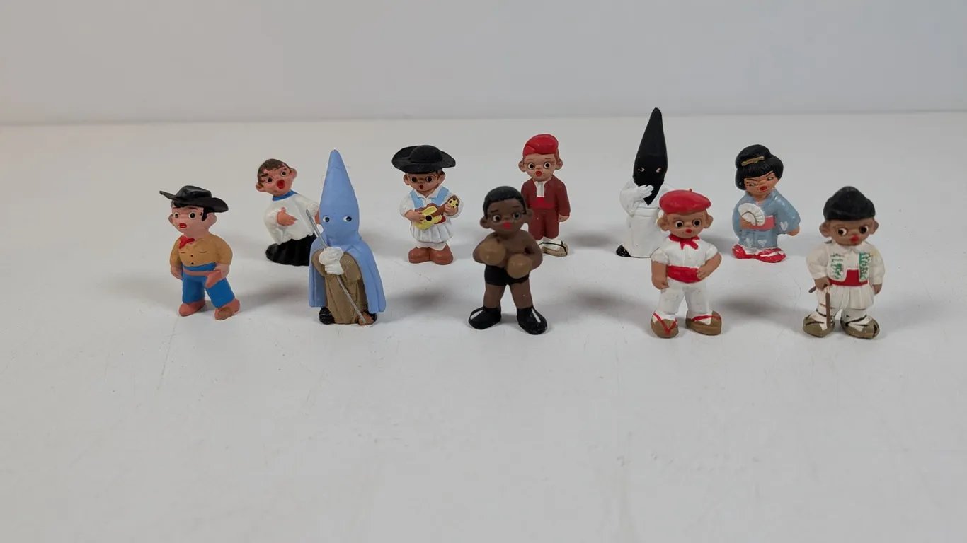 Collection of Ten Hand-Painted Miniature Mud People Figures