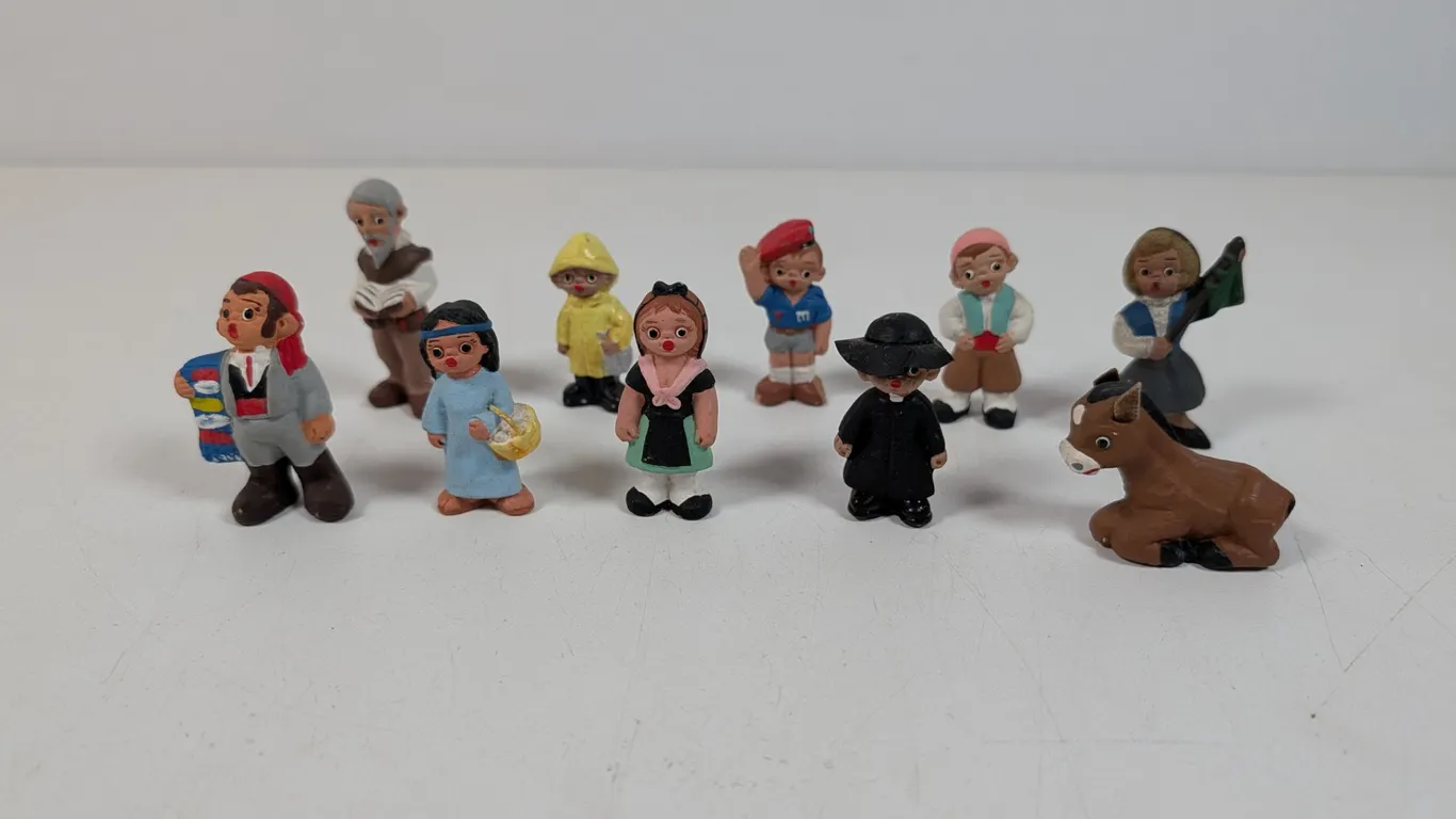 Collection of Miniature Hand-Painted Mud People Figurines