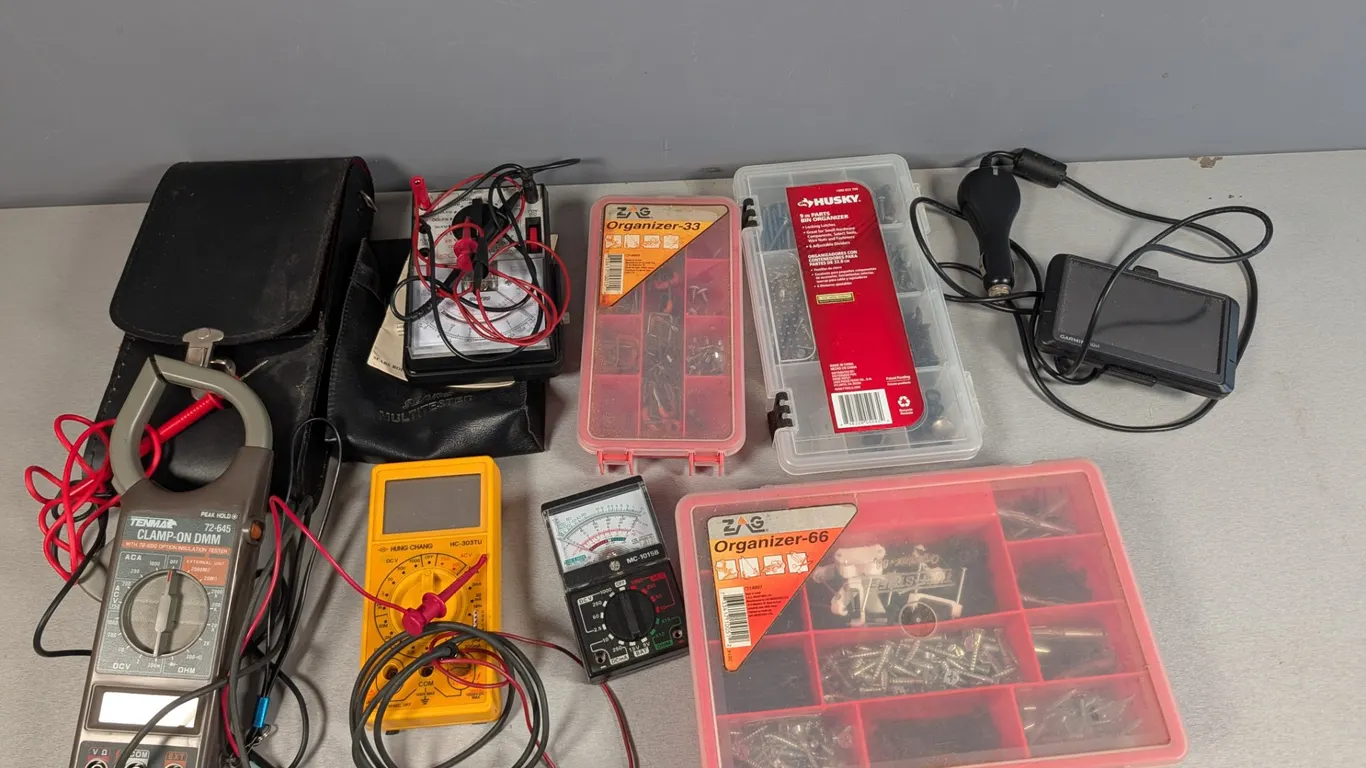 Electronics and Hardware Lot with Garmin Nuvi GPS, Multimeters, and Organizers