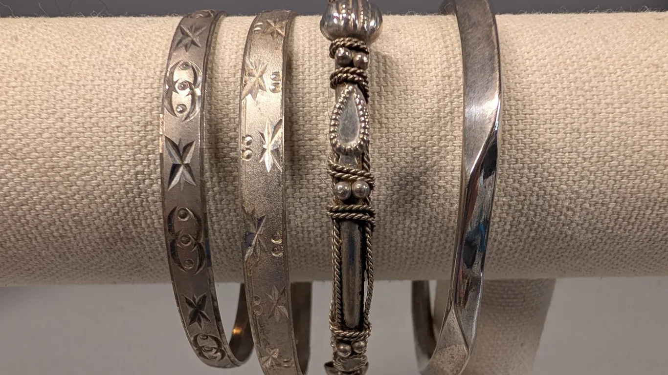 Four Silver tone Bangles with Engraved and Wire-Wrapped Designs