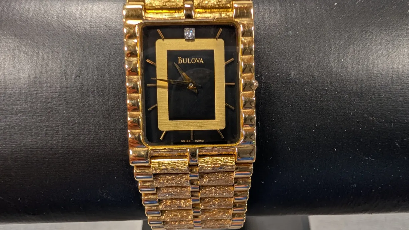 Bulova Gold Tone Quartz Watch with Diamond Accent