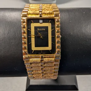Bulova Gold Tone Quartz Watch with Diamond Accent