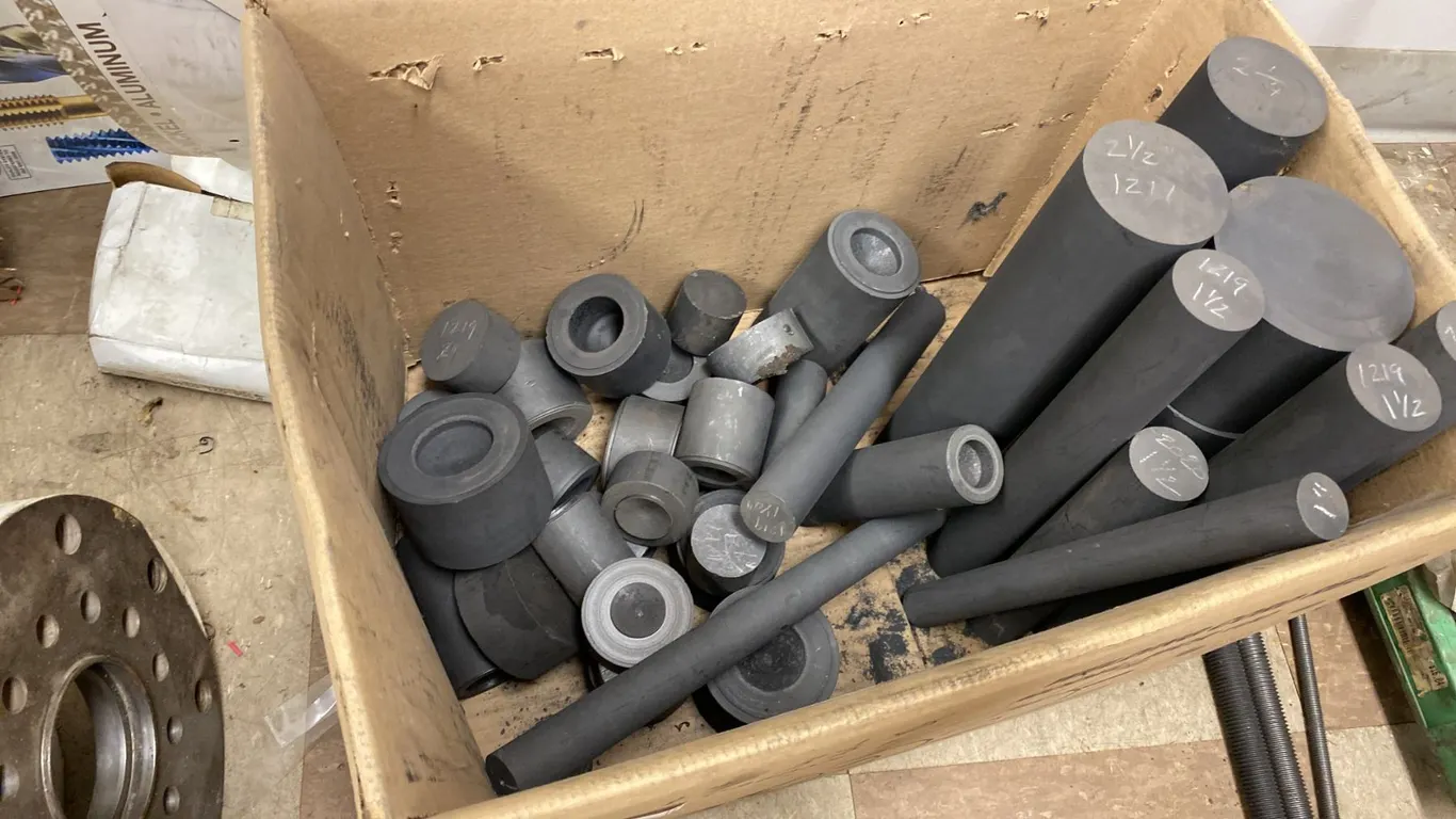 INVENTORY OF CARBON RODS FOR MILLING. 1"-3 1/2" DIAMETER. UP TO 12" LONG