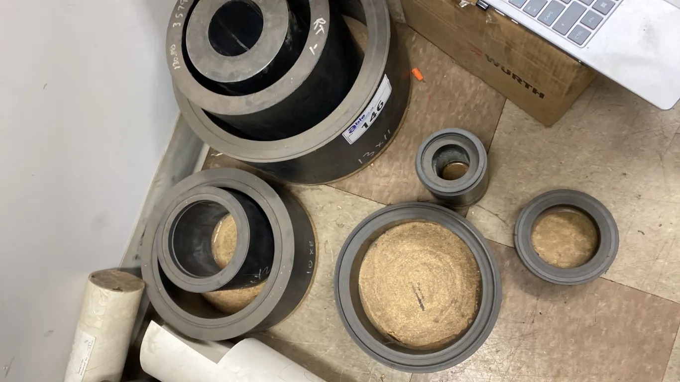 INVENTORY OF CARBON FIBER TEFLON TUBING. CAN BE USED FOR MAKING COMPRESSOR RINGS. 7 PCS, SIZES