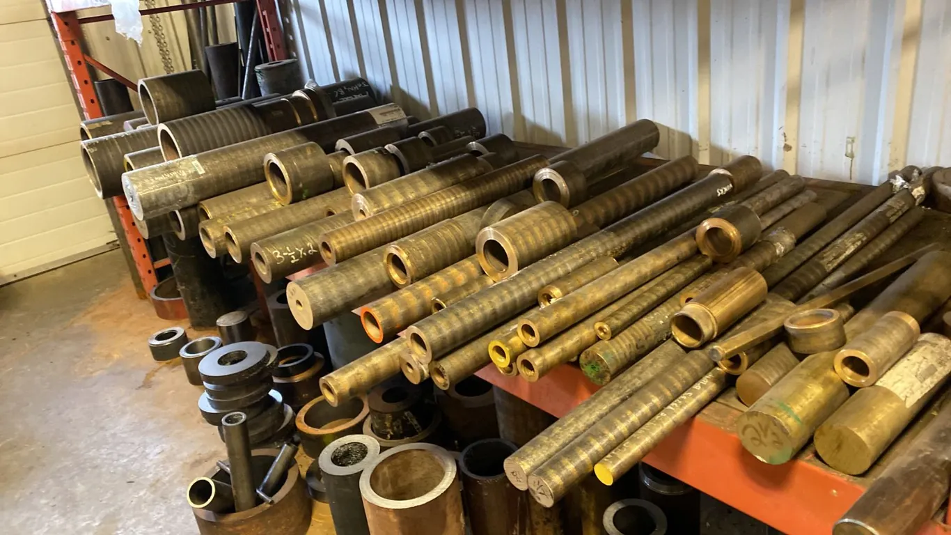 SHELF LOT OF 660 BRONZE TUBING AND BAR STOCK. SHORT LENGTHS UP TO 3'. DIAMETERS FROM