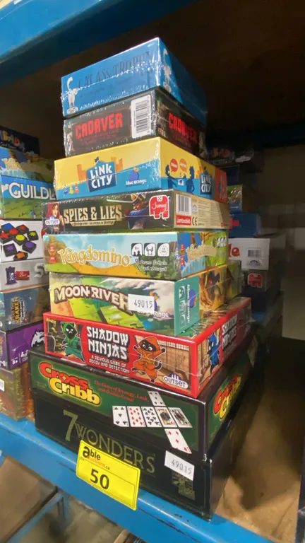 2 STACKS OF ASSORTED BOARD GAMES- SOME UNSEALED