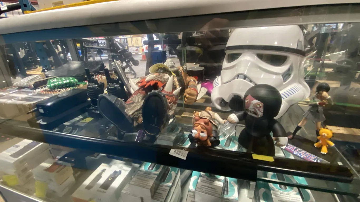 SHELF OF ASSORTED COLLECTABLES, ELECTRONICS, COIN PURSES & MORE