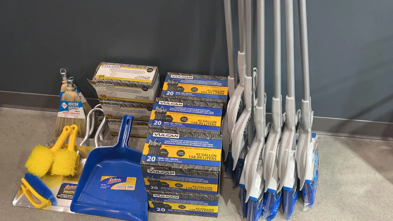Assortment of Brooms, Dust Pans, and Contractor Trash Bags