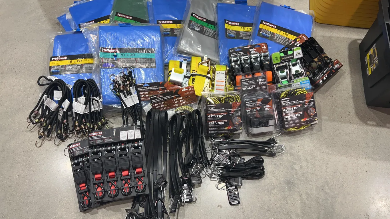 Assortment of Tarps, Ratchet Straps, and Bungee Cords