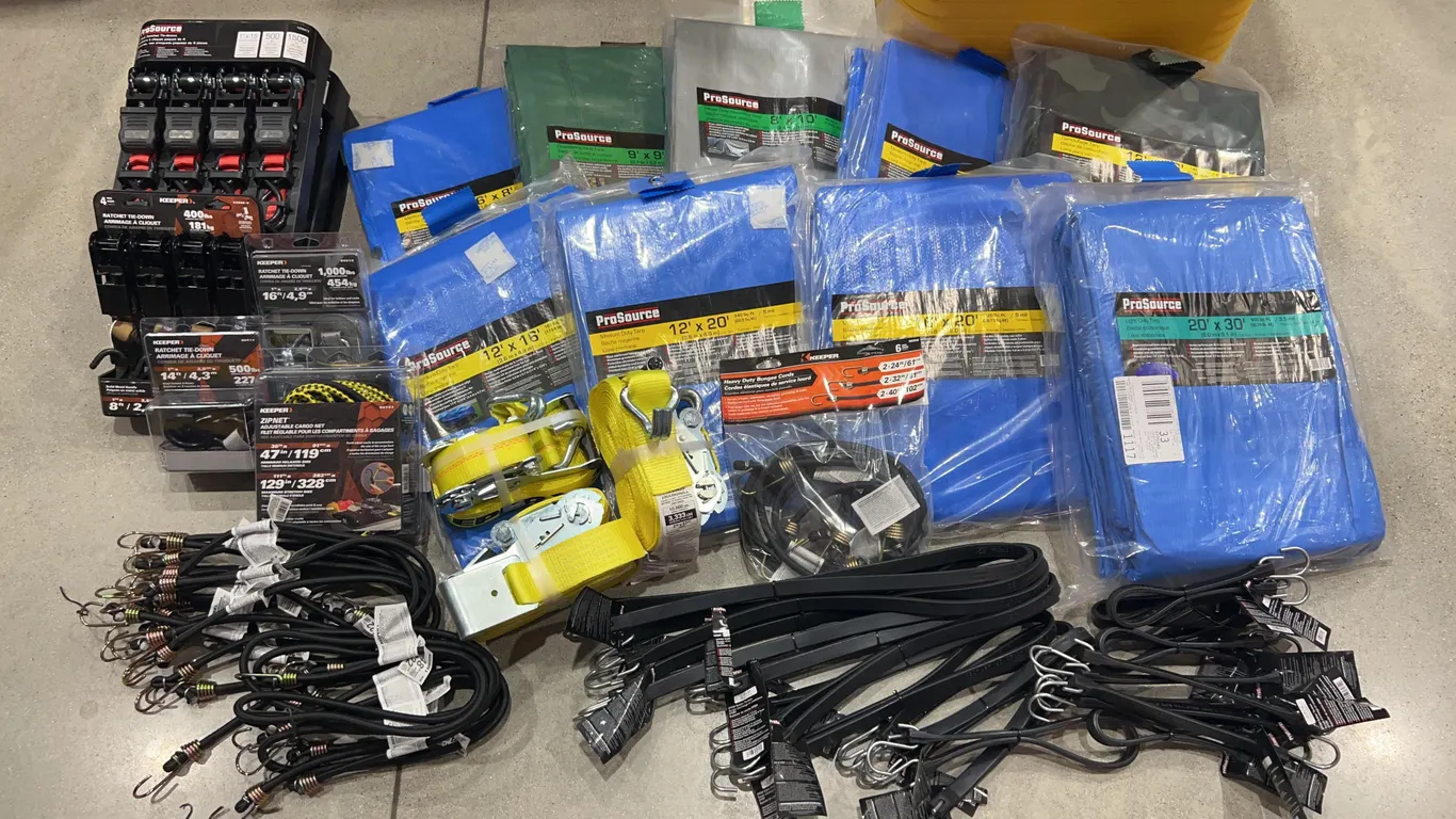 Assortment of Tarps, Ratchet Straps, and Bungee Cords