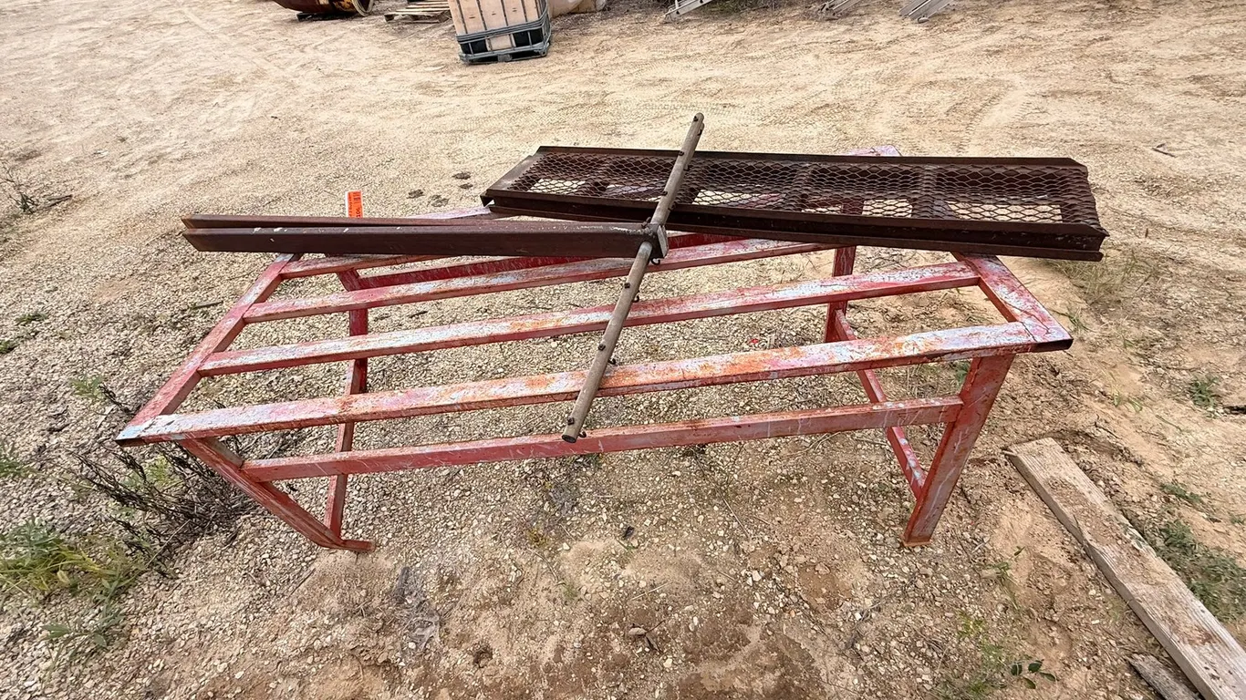 Bent Steel Table with Assorted Parts