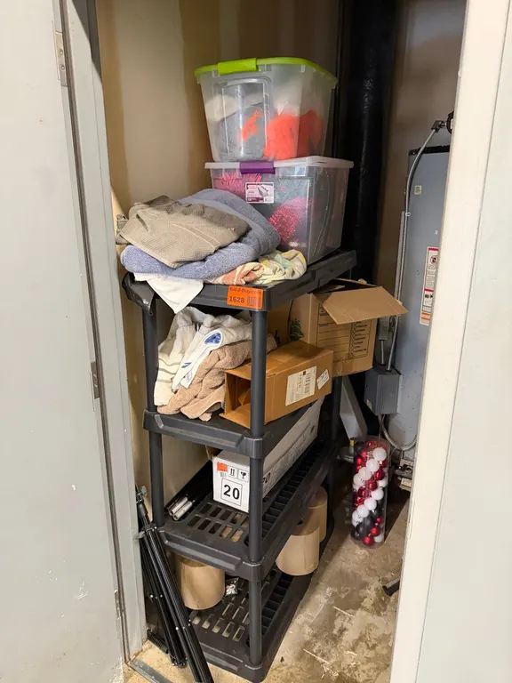 Plastic Shelf Unit with Decorations and Towels